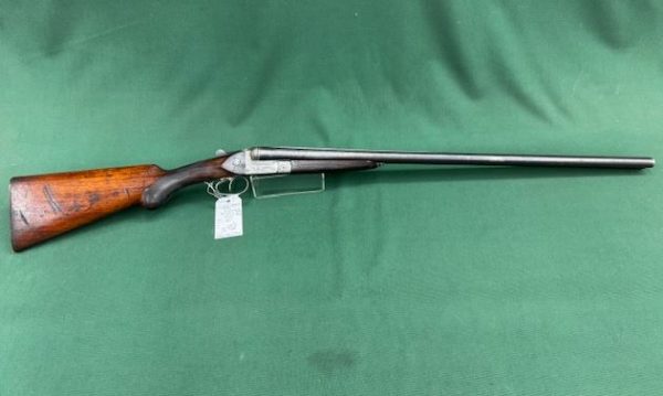 .12G UNKOWN MODEL ''RADARM'' SIDE x SIDE BLUED WOOD TWIN TRIGGERS 30'' BARRELS